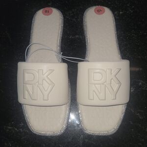 DKNY White Slide Sandals with Embossed Logo and Rhinestone Trim